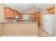 Eat-in kitchen with light wood cabinets, granite countertops, and appliances at 204 Atoll Dr., Myrtle Beach, SC 29588