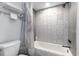 Updated bathroom with patterned tile and shower/tub combo at 211 Baslow Ct. # 2-C, Myrtle Beach, SC 29572