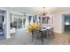 Bright dining area with yellow couch and modern table at 211 Baslow Ct. # 2-C, Myrtle Beach, SC 29572