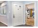 Interior view of condo entry with white door and view into living area at 211 Baslow Ct. # 2-C, Myrtle Beach, SC 29572