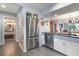 Kitchen with stainless steel refrigerator and view of bathroom at 211 Baslow Ct. # 2-C, Myrtle Beach, SC 29572