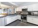 Modern kitchen with stainless steel appliances and gray countertops at 211 Baslow Ct. # 2-C, Myrtle Beach, SC 29572