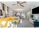 Living room with yellow couch, gray carpet and patio access at 211 Baslow Ct. # 2-C, Myrtle Beach, SC 29572