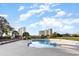 Community pool with surrounding deck and high-rise views at 211 Baslow Ct. # 2-C, Myrtle Beach, SC 29572