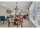 Elegant dining room with a glass-top table and chandelier at 2180 Waterview Dr. # 637, North Myrtle Beach, SC 29582