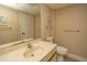 Clean bathroom with single sink vanity, toilet and shower at 2200 N Ocean Blvd., North Myrtle Beach, SC 29582