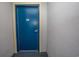 Building entrance with blue door and number 201 at 2200 N Ocean Blvd., North Myrtle Beach, SC 29582
