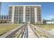 Building exterior showcasing beach access and walkway at 2200 N Ocean Blvd., North Myrtle Beach, SC 29582