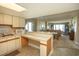 Kitchen with breakfast bar and view into living room at 2200 N Ocean Blvd., North Myrtle Beach, SC 29582