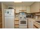 Well-equipped kitchen featuring white appliances at 2200 N Ocean Blvd., North Myrtle Beach, SC 29582