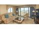 Living room with ocean view and comfy seating at 2200 N Ocean Blvd., North Myrtle Beach, SC 29582