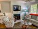 Inviting living room with coastal accents, a fireplace, and ample natural light at 222 Westleton Dr. # 18-C, Myrtle Beach, SC 29572