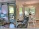 Comfortable living room with sliding barn door that leads to a furnished outdoor seating area at 222 Westleton Dr. # 18-C, Myrtle Beach, SC 29572