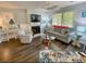 Comfortable living room featuring a decorative fireplace and hardwood floors at 222 Westleton Dr. # 18-C, Myrtle Beach, SC 29572