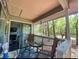 Inviting screened porch with comfortable seating and peaceful views of the outdoors at 222 Westleton Dr. # 18-C, Myrtle Beach, SC 29572