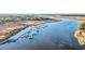 Picturesque aerial view of a marina with docked sailboats, set against a backdrop of tranquil waters and marshlands at 239 Madison Dr., Georgetown, SC 29440
