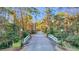 Charming community entrance with a bridge adorned with seasonal decorations and mature landscaping at 239 Madison Dr., Georgetown, SC 29440