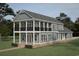 Charming two-story home with a covered porch and second-floor balcony showcasing a beautifully designed exterior at 239 Madison Dr., Georgetown, SC 29440