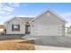 Gray house with a two-car garage and a well-maintained lawn at 248 Hickory Springs Ct., Conway, SC 29527