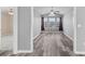 Bright living room with grey walls, vinyl flooring, and an abundance of natural light at 248 Hickory Springs Ct., Conway, SC 29527