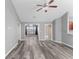 Open living room with gray walls and wood-look floors at 248 Hickory Springs Ct., Conway, SC 29527