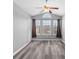 Sunroom features grey walls, vinyl flooring, ceiling fan and multiple windows at 248 Hickory Springs Ct., Conway, SC 29527