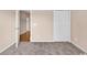 Carpeted bedroom with a view of the hallway, showing the flow of the home's layout at 4672 Lightkeepers Way # 50-E, Little River, SC 29566