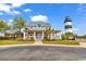 Charming two-story home with a front porch and a picturesque lighthouse backdrop at 4672 Lightkeepers Way # 50-E, Little River, SC 29566