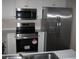 Stylish kitchen with stainless steel appliances, white cabinets, and a double-door refrigerator at 4672 Lightkeepers Way # 50-E, Little River, SC 29566