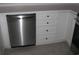 Well-equipped kitchen with stainless steel dishwasher, white cabinets, and ample storage at 4672 Lightkeepers Way # 50-E, Little River, SC 29566