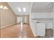 Open-concept living room and kitchen features vaulted ceilings, skylights, and modern fixtures at 4672 Lightkeepers Way # 50-E, Little River, SC 29566