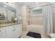 Clean bathroom with bathtub, shower, and white cabinets at 47 Isle Of Palms Dr., Murrells Inlet, SC 29576