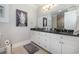 Bathroom with granite countertop, white cabinets, and a large mirror at 47 Isle Of Palms Dr., Murrells Inlet, SC 29576