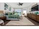 Main bedroom with large windows, hardwood floors and tropical bedding at 47 Isle Of Palms Dr., Murrells Inlet, SC 29576