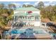 Large swimming pool with patio furniture and outdoor kitchen at 47 Isle Of Palms Dr., Murrells Inlet, SC 29576