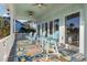 Covered porch with multiple chairs and view of the water at 47 Isle Of Palms Dr., Murrells Inlet, SC 29576