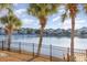 Beautiful waterfront view with palm trees and homes at 47 Isle Of Palms Dr., Murrells Inlet, SC 29576