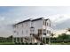 Two-story home with white siding, black accents, and a wrap around porch at 48 Furman Ln., Pawleys Island, SC 29585