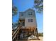 Two-story light blue and white beach house under construction at 48 Furman Ln., Pawleys Island, SC 29585
