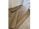 Light brown wood-look vinyl plank flooring being installed at 48 Furman Ln., Pawleys Island, SC 29585