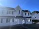 Two-story light gray building with white trim and landscaping at 500 Fairway Village Dr. # 8E, Myrtle Beach, SC 29588