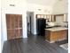 Small kitchen with dark countertops and black appliances at 500 Fairway Village Dr. # 8E, Myrtle Beach, SC 29588