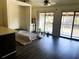 Living room with sliding glass doors and a small bed at 500 Fairway Village Dr. # 8E, Myrtle Beach, SC 29588