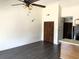 Simple living room with dark gray floors and a closet at 500 Fairway Village Dr. # 8E, Myrtle Beach, SC 29588