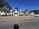 Community clubhouse with welcoming entrance and landscaping at 5010 Windsor Green Way # 301, Myrtle Beach, SC 29579