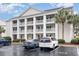 Condo building with parking and landscaping; inviting entrance at 5010 Windsor Green Way # 301, Myrtle Beach, SC 29579