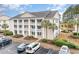 Condo building with columns and balconies, offering convenient parking at 5010 Windsor Green Way # 301, Myrtle Beach, SC 29579