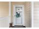 Condo front door with glass panel and decorative accents at 5010 Windsor Green Way # 301, Myrtle Beach, SC 29579