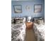 Bright guest bedroom with two twin-size beds and nightstand at 5010 Windsor Green Way # 301, Myrtle Beach, SC 29579