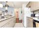 View of kitchen with granite countertops and white appliances at 5010 Windsor Green Way # 301, Myrtle Beach, SC 29579